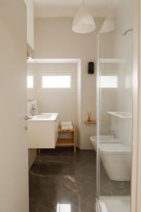 a bathroom with a sink and a toilet and a shower at La Casa del Borgo in Rieti