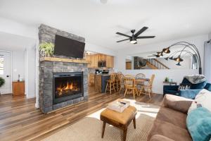 a living room with a fireplace and a couch at Soda Springs Ranch Unit 3C in Grand Lake