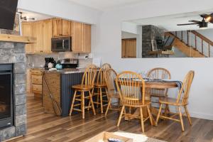 a kitchen with a table and chairs in a kitchen at Soda Springs Ranch Unit 3C in Grand Lake +22 photos