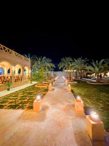 a row of lights in a park at night at SiwaTu Lodge in Siwa