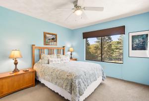 a bedroom with a bed and a window at Seven Springs Resort Properties by Vail Resorts in Champion