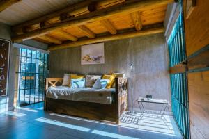 a bedroom with a bed in a room at Alamos de Perdriel in Perdriel