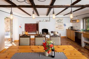 a kitchen and dining room with a table and chairs at Feriengut Welzin in Welzin
