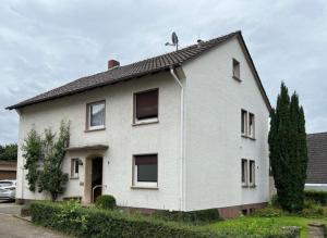 a white house with a lot of windows at FeWo Kalletal in Kalletal