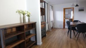 a living room with a table and a dining room at FeWo Kalletal in Kalletal