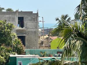 a view of a building from the street at Jacobs Cottage KG-G1 in Thiruchendur