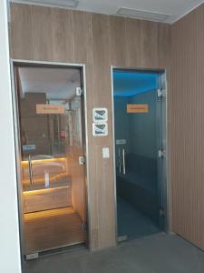 two elevators in a building with signs on them at Departamento BOSQUE - Unidad 218 in Costa del Este +19 photos