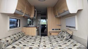 a bedroom with a bed in a rv at Rover Rentals in Inverness +10 photos