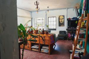a living room with a table and a room with at Ramallo es Bienestar 8 plazas in Ramallo +17 photos