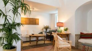a living room with a couch and a table at La Escribana in Constantina