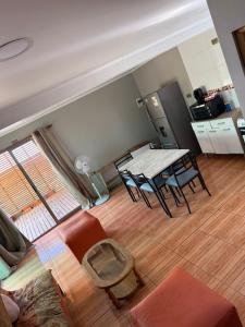 a living room with a table and a couch at Radal Riverside Lodge in El Torreón