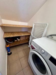 a washer and dryer in a room with at Sxm Caribbean Nest in Saint Martin