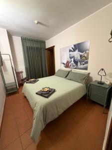 a bedroom with a bed with a tray on it at Casa Cuoco in Civita Campomarano