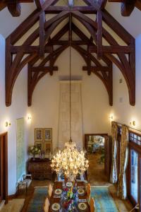 a dining room with a chandelier hanging from the ceiling at Chateau Okanagan in Kelowna