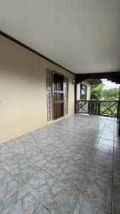 an empty room with a patio with a door at Blissfull Corner at Centerpoint Unit 1 in Suva +13 photos