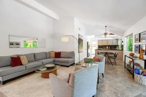 a living room with a couch and a table at Alejo Olive Orchard - Alice Lodging in Palm Springs