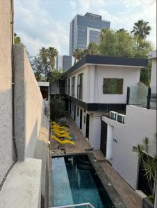 a balcony of a building with a swimming pool at Adhoc Boutique Barrio Antiguo in Monterrey