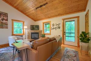a living room with a couch and a tv at Havenwood in Logan