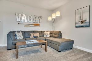 a living room with a couch and a coffee table at The Retreats at Stone Fountain in Arnolds Park