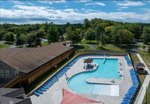 an overhead view of a swimming pool at a resort at Cozy Pocono Retreat in Tobyhanna