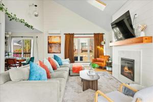 a living room with couches and a fireplace at Cozy Pocono Retreat in Tobyhanna