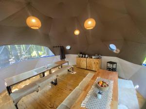 a large room with a table and a large window at Fitz Roy Comfort Camp - El Chaltén in El Chalten
