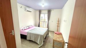 a small room with a small bed and a window at Maramar Beach House in Luis Correia +23 photos