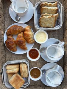a table topped with plates of bread and pastries at Etel in San Rafael +21 photos