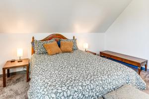 a bedroom with a large bed and two lamps at Walkable Location, Historic Setting: Warrenton Apt in Warrenton