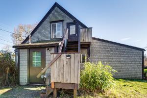 a small house with a staircase in front of it at Walkable Location, Historic Setting: Warrenton Apt in Warrenton