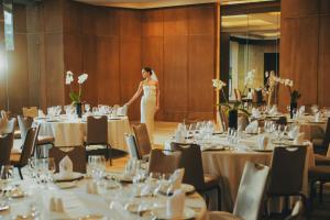 a woman in a white dress standing in a banquet hall at JW Marriott Hotel Mexico City Polanco in Mexico City +127 photos