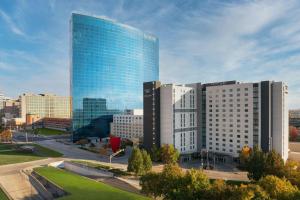 a large glass building in front of a city at JW Marriott Indianapolis in Indianapolis