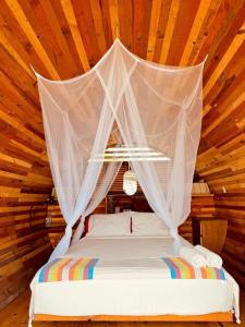 Katil atau katil-katil dalam bilik di HOTEL EXTASIS ZIPOLITE nudista en zona de fiesta
