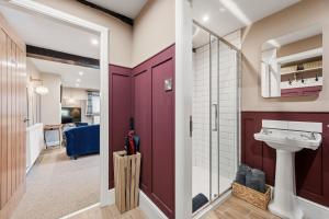 a bathroom with a sink and a mirror at The Forge in Castleton +66 photos