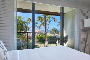 a bedroom with a bed and a view of the ocean at Wailea Beach Resort - Marriott, Maui in Wailea +291 photos