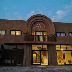 a building with a sign that says xaya coming at SAYA Coliving in El Paredón Buena Vista