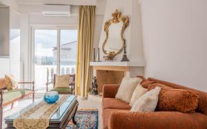 a living room with a couch and a table at Villa Luna in Káto Ássos