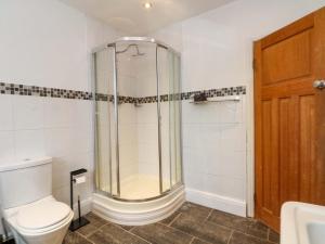 a bathroom with a shower and a toilet at Broadgreen in Liverpool +13 photos