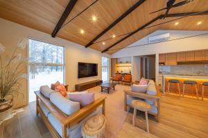 a living room with a couch and a table at Sakuraya in Hakuba