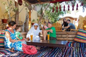 a group of people sitting around a table at Dive Urge in Dahab