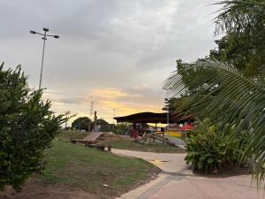 a park with a picnic table and a tent at Quarto confortável no Centro- Wi-Fi rápido, ar-condicionado in São Luís