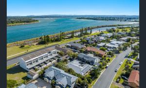 an aerial view of a town next to a river at Beach Side Getaway Lighthouse Beach in East Ballina