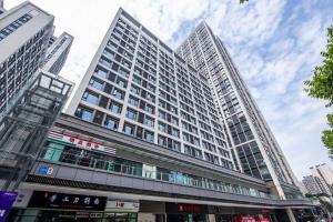 a tall building with many windows in a city at Ibis Chengdu High-tech Tianfu Software Park in Chengdu