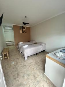 a bedroom with a bed in the corner of a room at Casa de Aire Ezeiza in La Unión