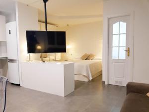 Posteľ alebo postele v izbe v ubytovaní Suites Garden Apartamento 33