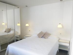 Posteľ alebo postele v izbe v ubytovaní Suites Garden Apartamento 33