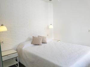 Posteľ alebo postele v izbe v ubytovaní Suites Garden Apartamento 33
