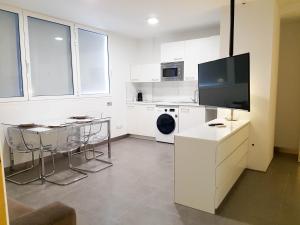 Televízia a/alebo spoločenská miestnosť v ubytovaní Suites Garden Apartamento 33