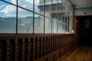 a room with a window with a view of the golden gate bridge at Moty's Guesthouse in Cusco +1 photo