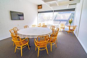 a conference room with a table and chairs at The Beach Hotel Whyalla in Whyalla